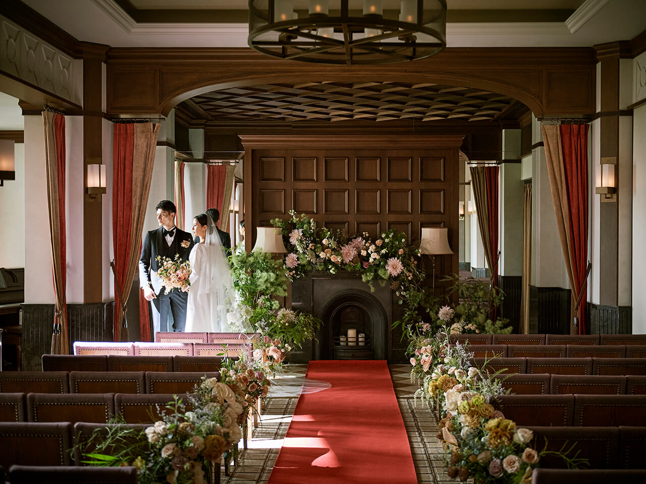 Bride and groom facing each other at the wedding hall